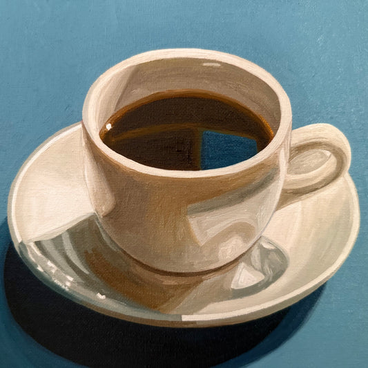 Black coffee on teal