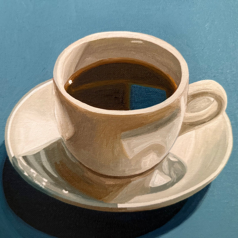 Black coffee on teal