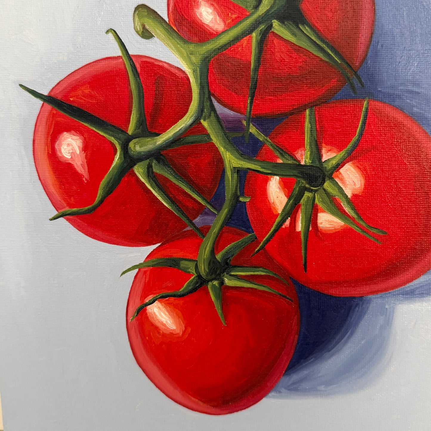 Four Tomatoes on Blue